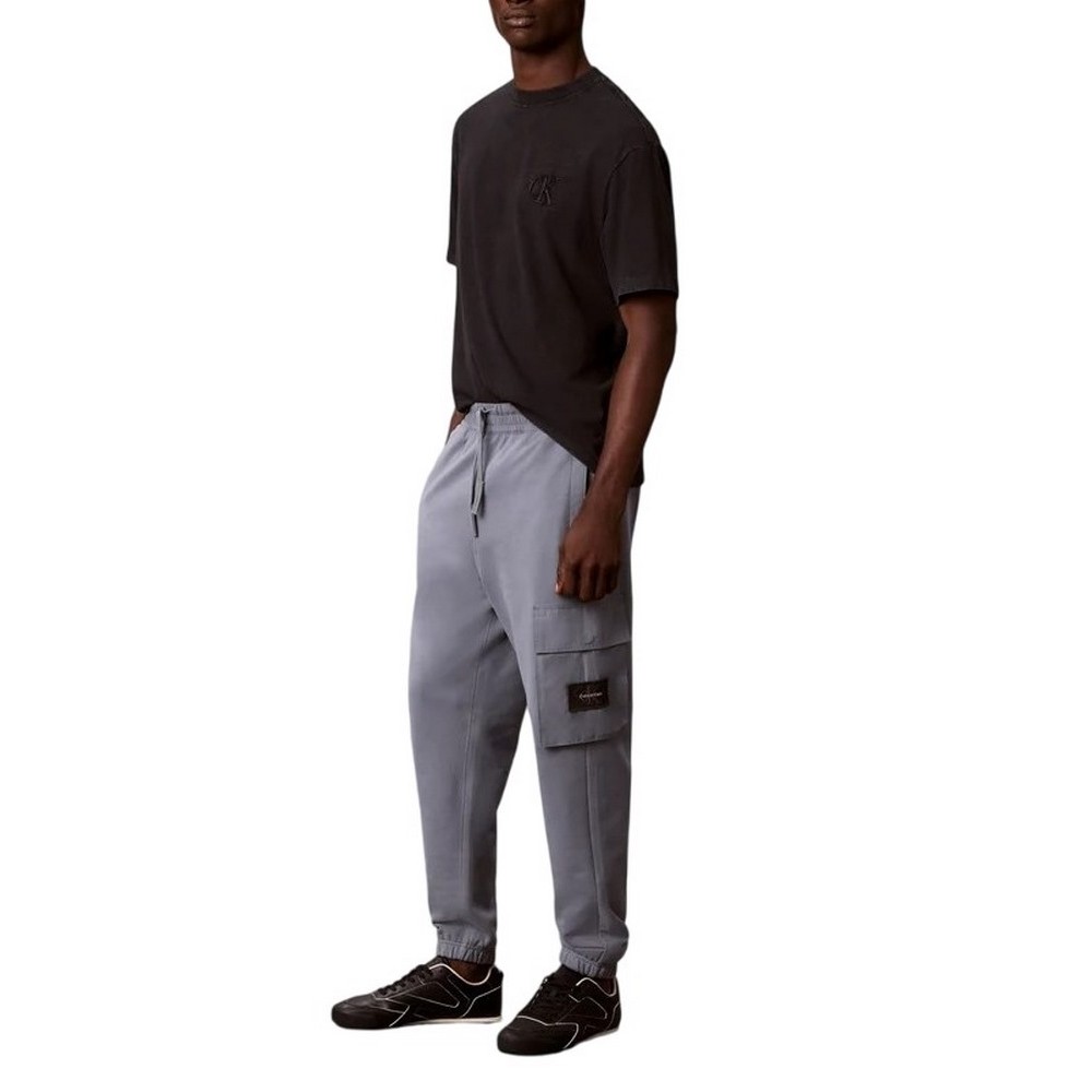 CALVIN KLEIN JEANS EU 350TERRY BADGE JOGGER ΦΟΡΜΑ ΠΑΝΤΕΛΟΝΙ ΑΝΔΡΙΚΟ STEEL GRAY